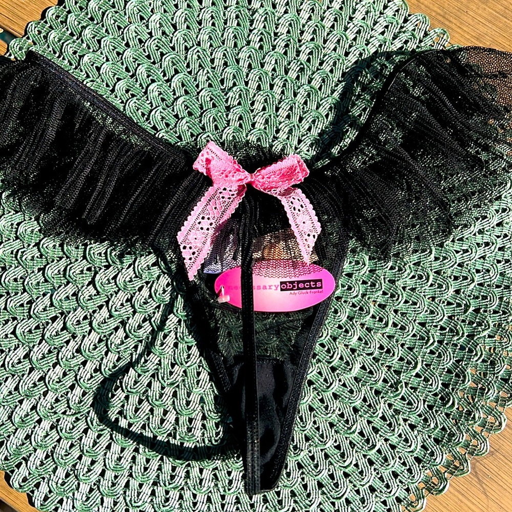NWT Size large black thong with pink bow 🎀 on back with ruffle.